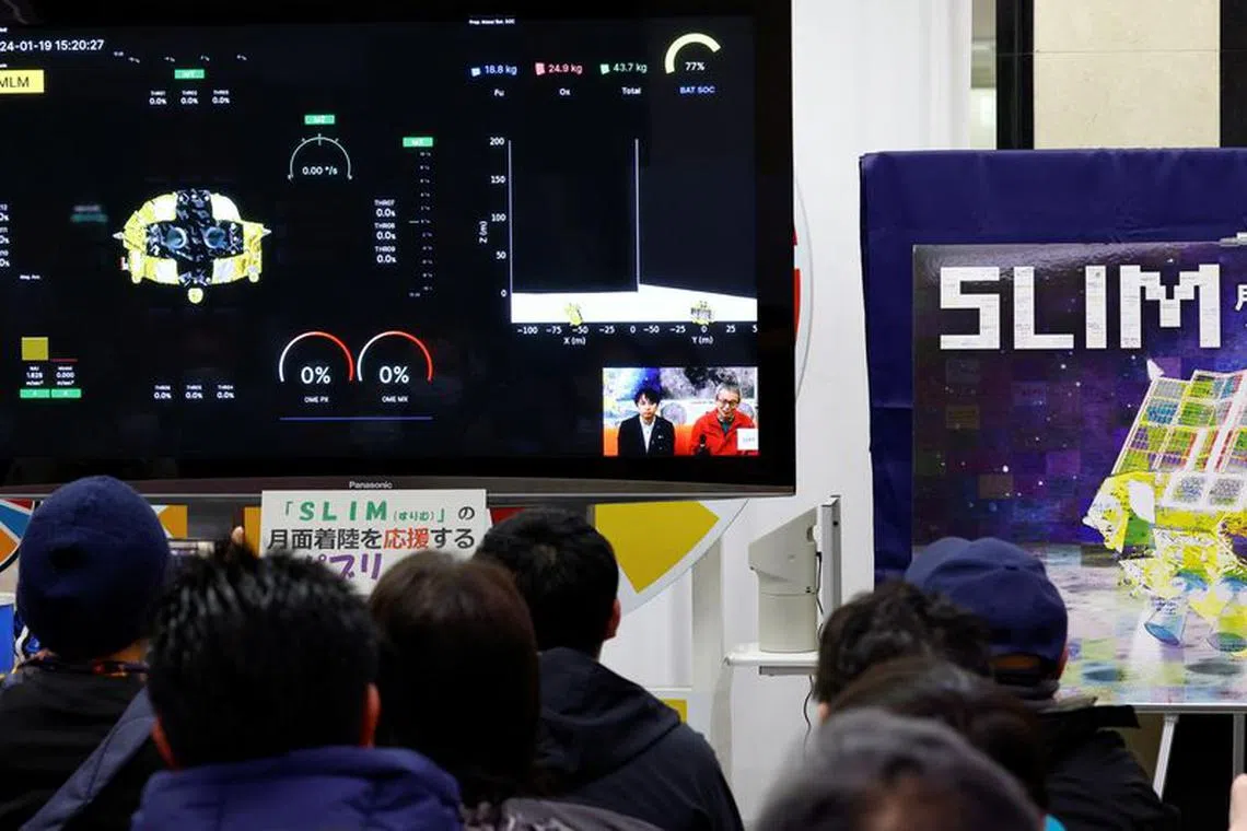 FILE PHOTO: People watch the Smart Lander for Investigating Moon (SLIM)'s landing on the moon in a public viewing event in Sagamihara, south of Tokyo, Japan January 20, 2024. REUTERS/Kim Kyung-Hoon/File Photo