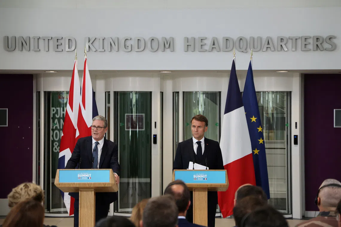 FILE PHOTO: Britain's Prime Minister Keir Starmer and France's President Emmanuel Macron address a joint press conference following a meeting of the Coalition of the Willing at a military base at Northwood Headquarters in north-west London, Britain, on July 10, 2025. LUDOVIC MARIN/Pool via REUTERS/File Photo