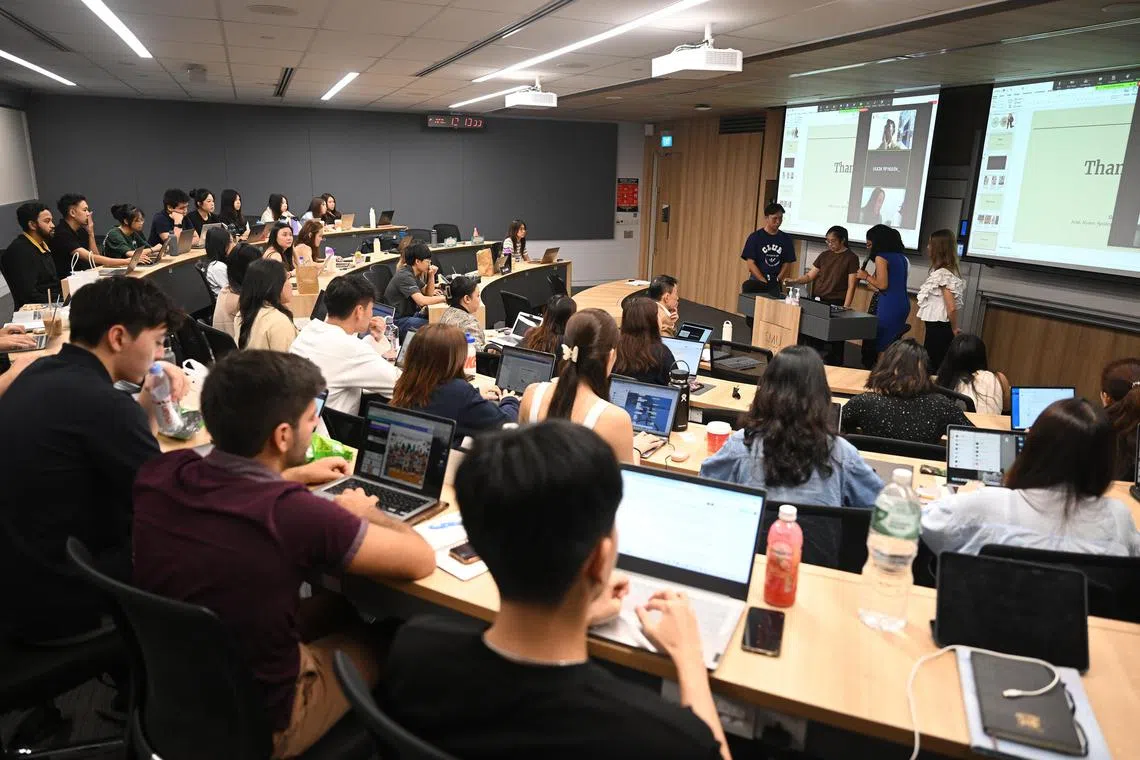Students at Singapore Management University presenting their videos created using Artificial Intelligence for an advertising campaign for the Storytelling For Organisations and Brands module on April 1.