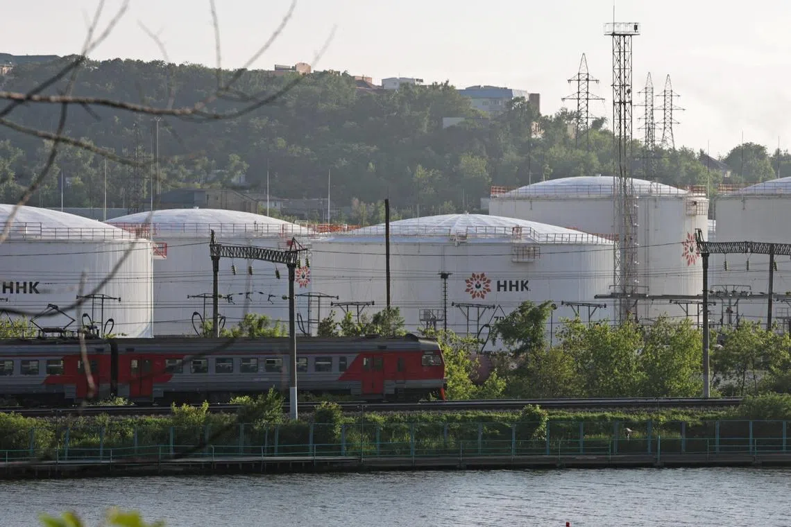 A train moving past oil tanks of the NNK-Primornefteproduct petroleum depot in the far eastern port of Vladivostok, Russia in June last year.