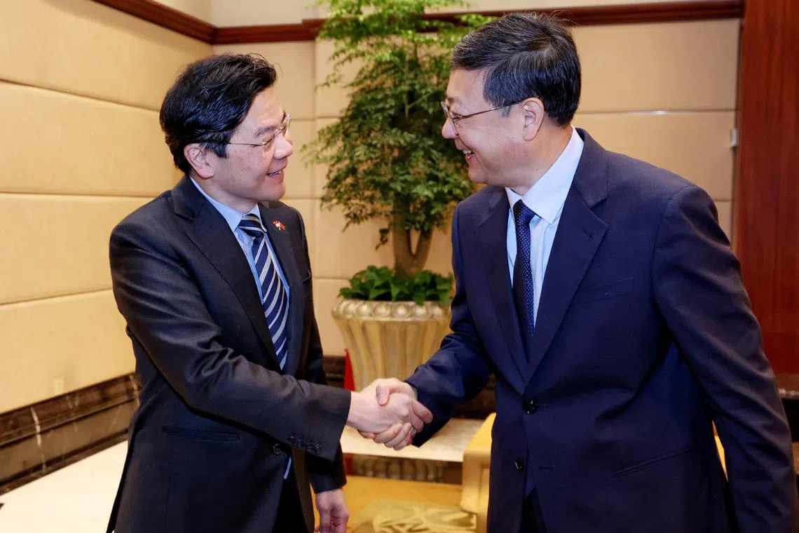 DPM Lawrence Wong (left) met Shanghai party chief Chen Jining for the first time since they were appointed to their respective positions.