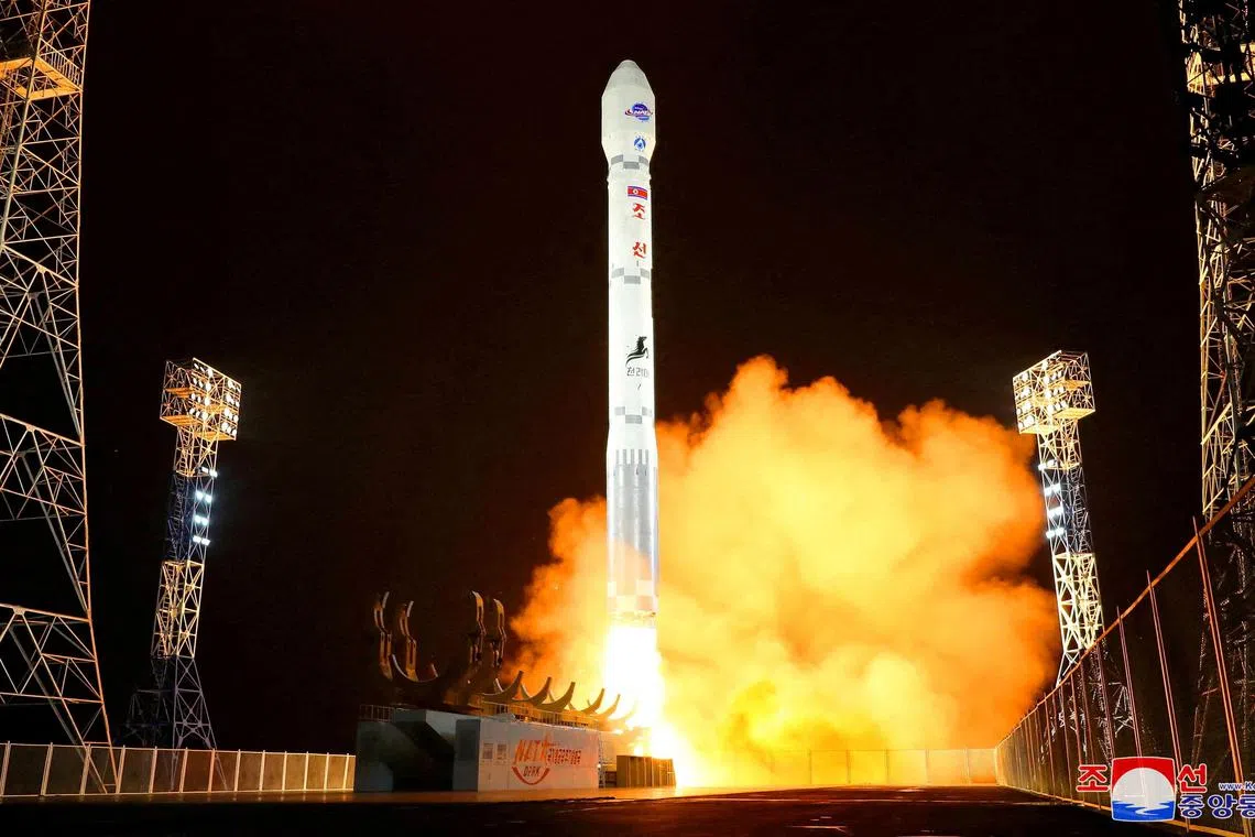 A rocket carrying a spy satellite Malligyong-1 is launched, as the North Korean government claims, in a location given as North Gyeongsang Province, North Korea in this handout picture obtained by Reuters on Nov 21.  