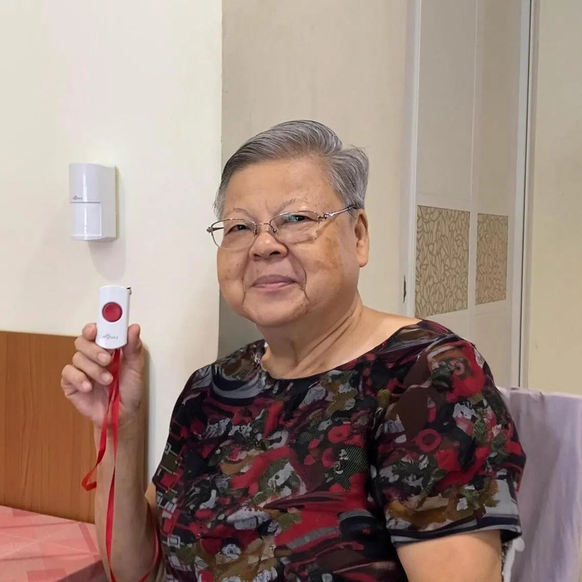 Madam Ng Ban Wee, 72, a beneficiary of the Singapore Red Cross who lives alone, will be getting the new 3D motion detector.