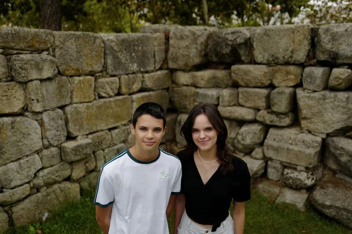 FILE PHOTO: Andre, 15 and Sofia Oliveira, 18 pose for a picture in Almada, Portugal, July 29, 2023. They are part of a group of six that took action in the European court against 32 countries for allegedly failing to do their part to avert climate catastrophe. REUTERS/Pedro Nunes/File Photo