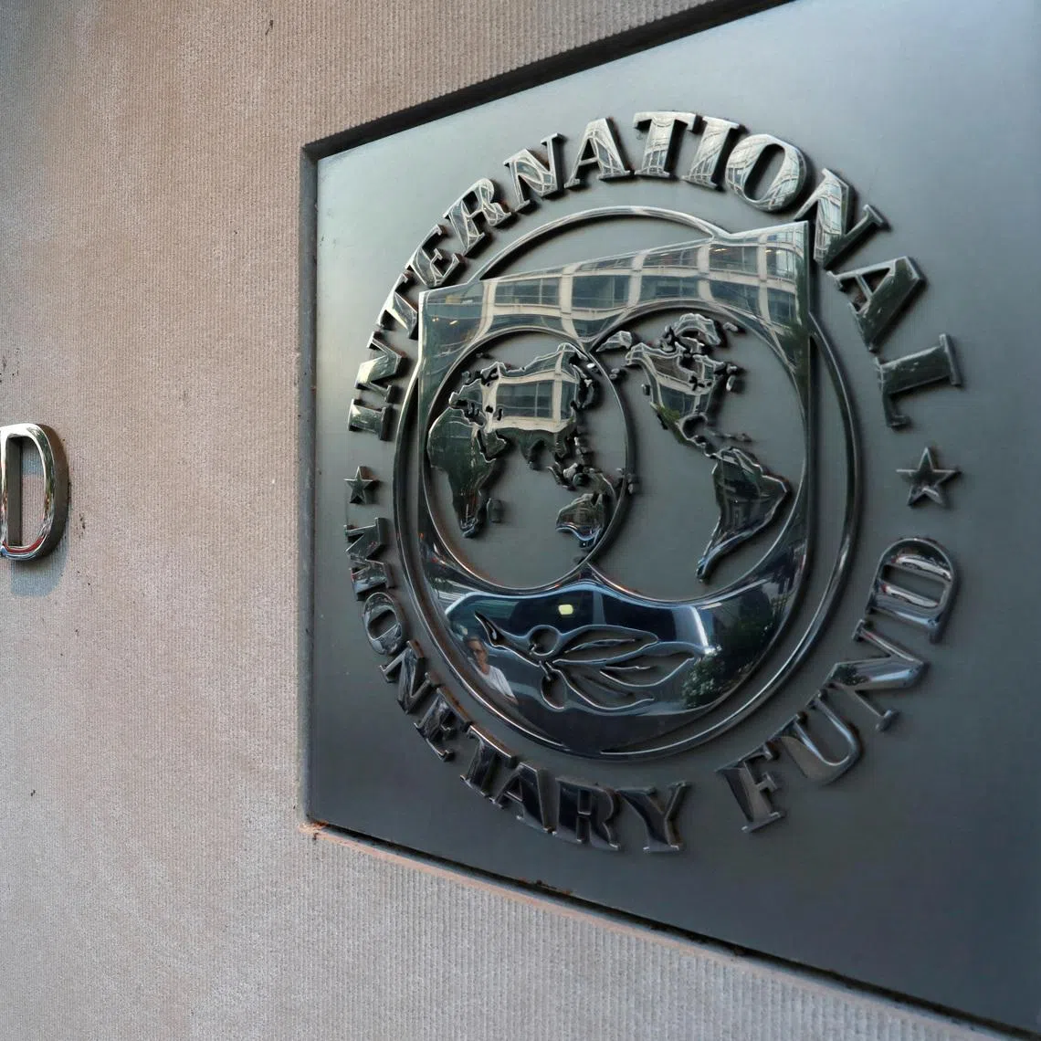International Monetary Fund (IMF) logo is seen outside the headquarters building in Washington, U.S., September 4, 2018. REUTERS/Yuri Gripas