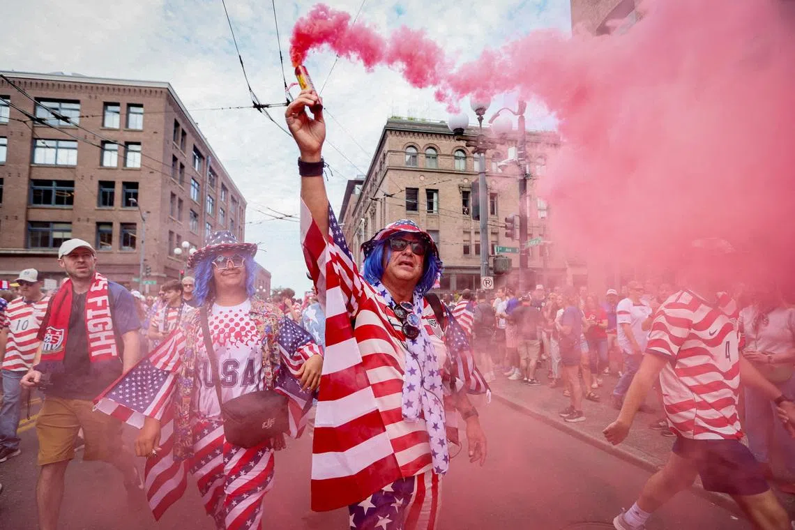 Soccer Football - FIFA World Cup 2026 - Group D - United States v Australia - Fans in Seattle - Seattle, Washington, U.S. - June 19, 2026 A United States fan sets off a flare at a screening in Seattle ahead of the match IMAGN IMAGES via Reuters/Kevin Ng