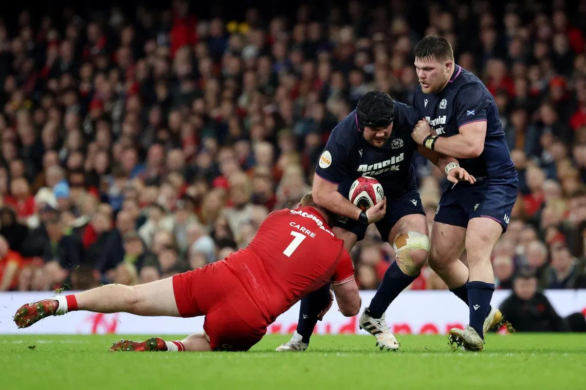 Rugby Union - Six Nations Championship - Wales v Scotland - Principality Stadium, Cardiff, Wales, Britain - February 21, 2026 Scotland's Gregor Brown in action with Wales' Rhys Carre REUTERS/Cat Goryn