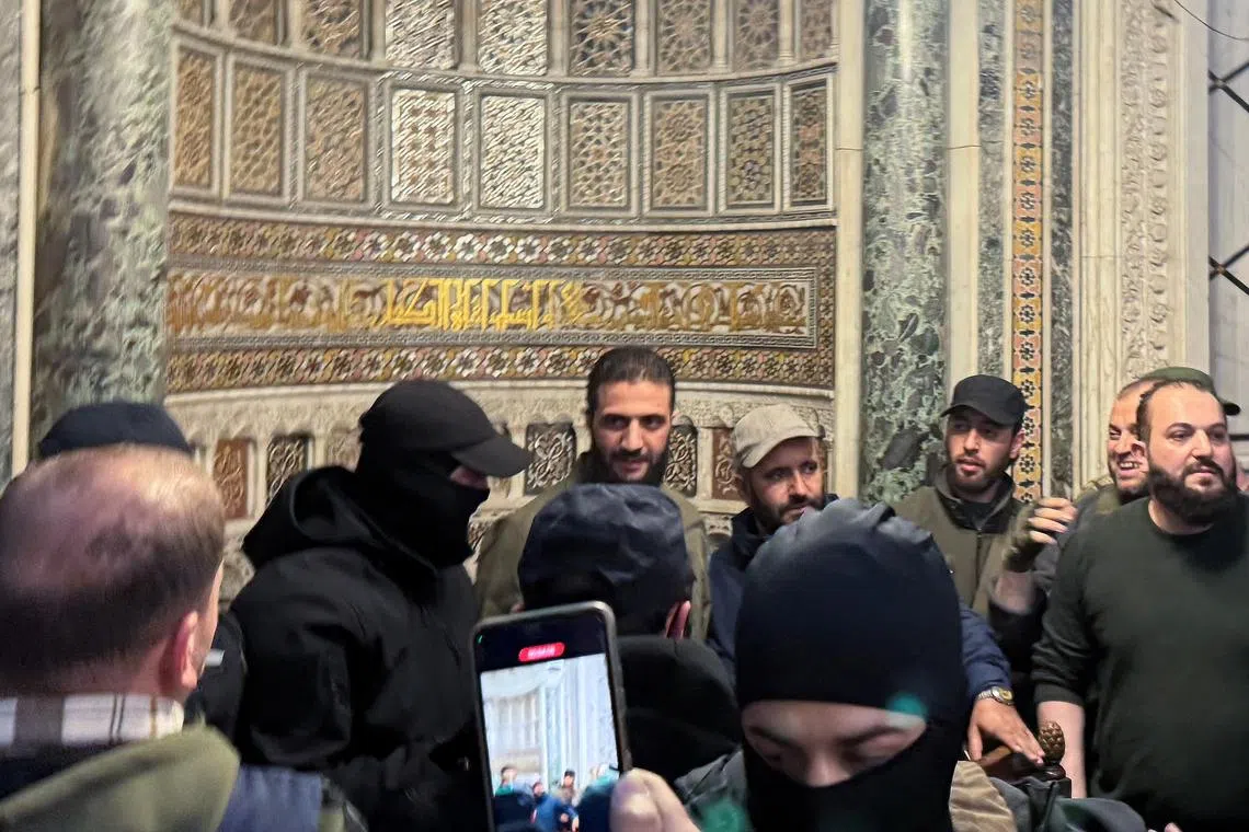 Top rebel commander Abu Mohammed al-Golani talks to the crowd at Ummayad Mosque in Damascus after Syrian rebels announced that they have ousted President Bashar al-Assad, Syria December 8, 2024. REUTERS/Mahmoud Hassano/File Photo