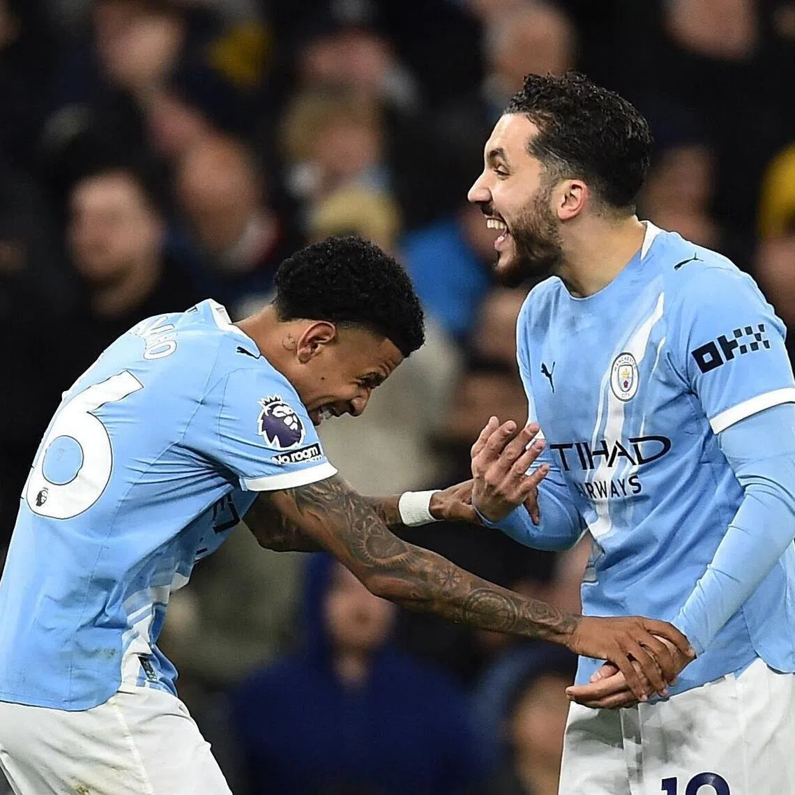 Manchester City's Savinho celebrates scoring their third goal against Palace on May 13 with Rayan Cherki.