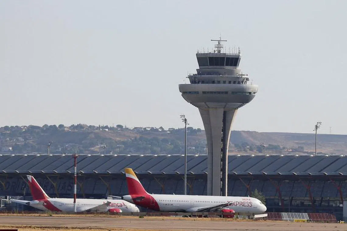 FILE PHOTO: Aircraft are seen on the tarmac of Adolfo Suarez Madrid-Barajas Airport, in Madrid, Spain, August 27, 2022. REUTERS/Isabel Infantes