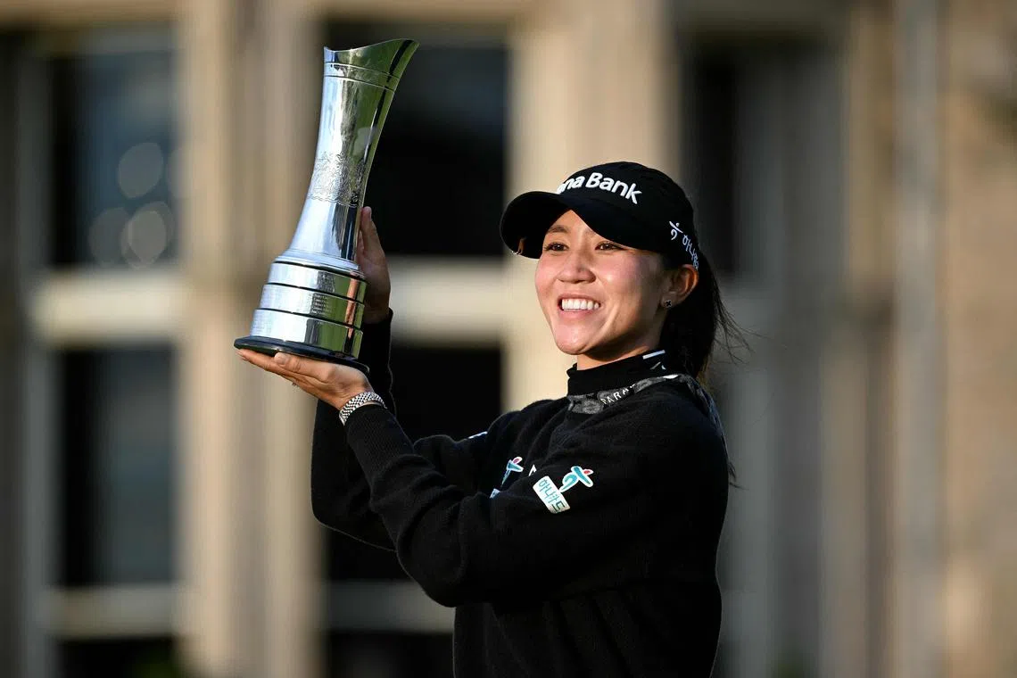 New Zealand's Lydia Ko poses with the trophy after winning the 2024 Women's British Open on Aug 25.
