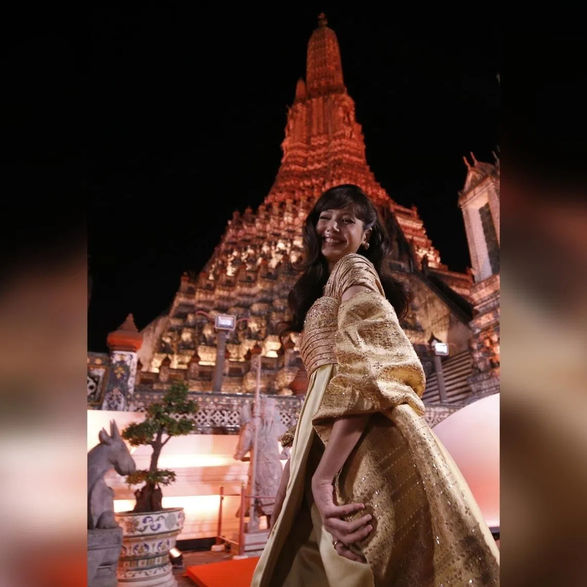 Blackpink star Lisa arrives for the Amazing Thailand Ambassador Exclusive Night at the Temple of Dawn or Wat Arun in Bangkok on Jan 28.