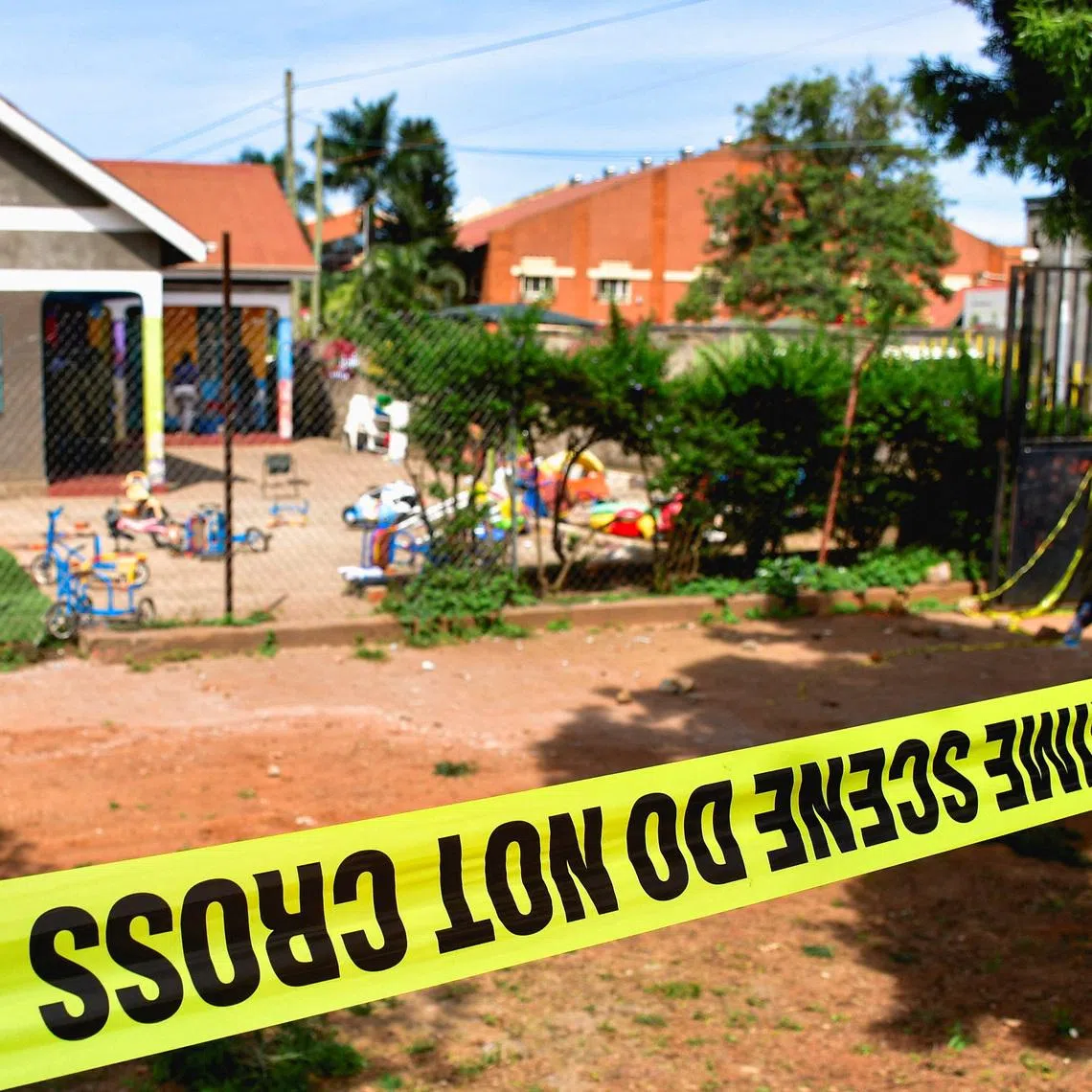 Police tape at the scene after a man posing as a parent stabbed and killed children at a school in Kampala, Uganda, April 2, 2026.