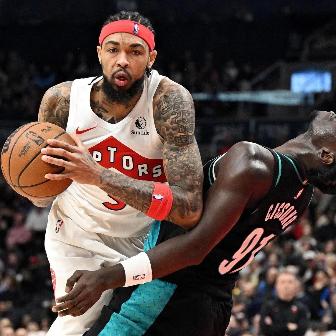 Toronto Raptors forward Brandon Ingram fouls Portland Trail Blazers forward Sidy Cissoko in the second half at Scotiabank Arena. 