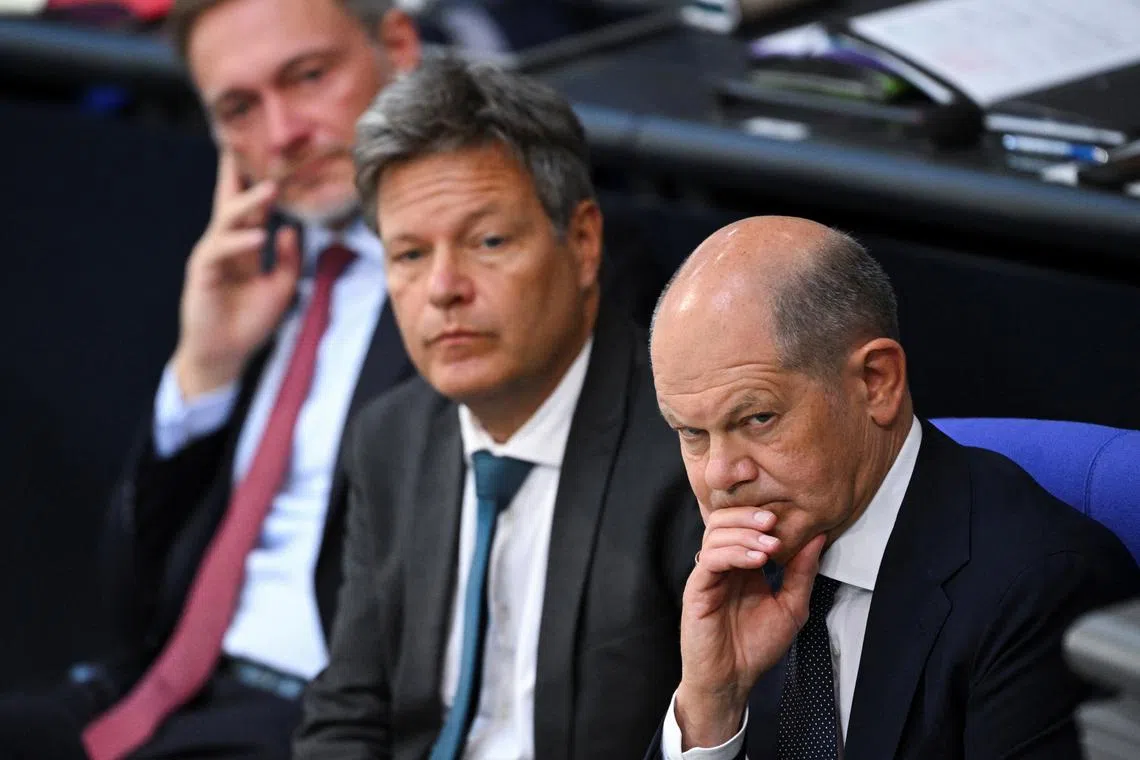 FILE PHOTO: German Chancellor Olaf Scholz, Economy and Climate Minister Robert Habeck, and Finance Minister Christian Lindner look on after a government statement about current security issues at the lower house of parliament, the Bundestag, in Berlin, Germany, June 6, 2024. REUTERS/Annegret Hilse/File Photo