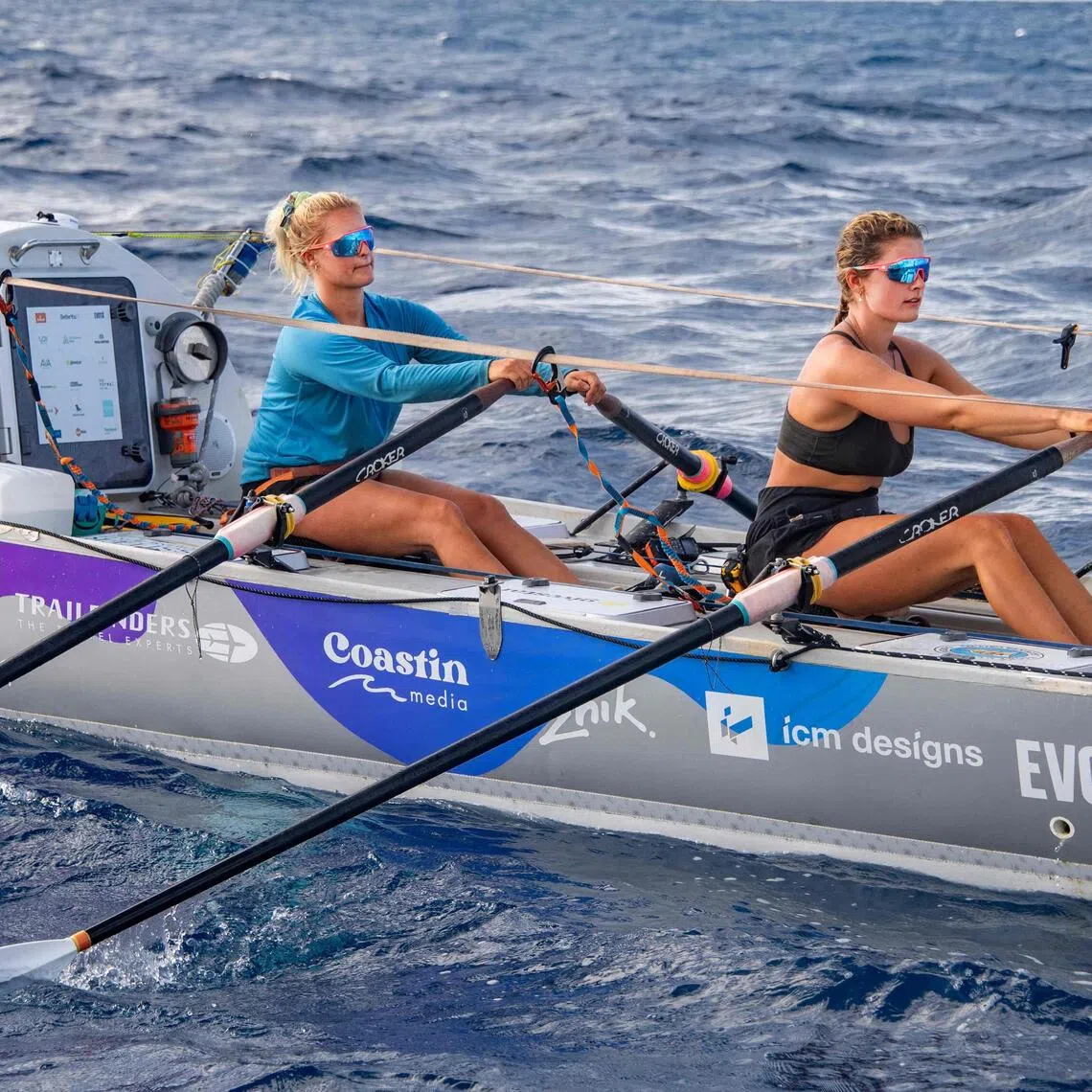 British rowers Jess Rowe (left) and Miriam Payne in their vessel Velocity as they approach Australia's Great Barrier Reef in the Coral Sea on Oct 17, 2025. The pair left Peru on May 5 for the journey to Australia, raising money for charity and attempting to become the first women's team and the first pair to row across the Pacific Ocean non-stop and unsupported.
