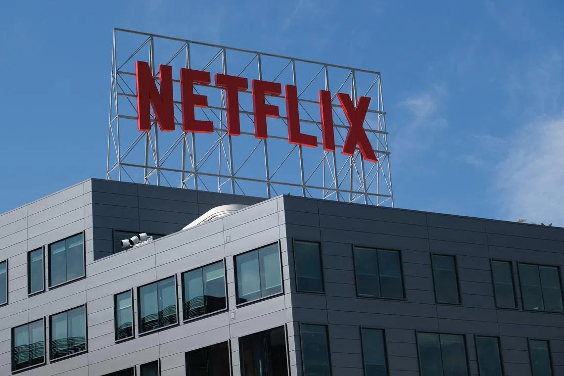 (FILES) The Netflix logo is seen on top of their office building in Hollywood, California, March 2, 2022. Netflix on July 19, 2023 said subscriptions to the streaming television service climbed to more than 238 million in the wake of its crackdown on password sharing. Netflix finished the recently ended quarter with an addition 5.9 million subscribers and a profit of $1.5 billion, according to an earnings release. (Photo by Chris DELMAS / AFP)