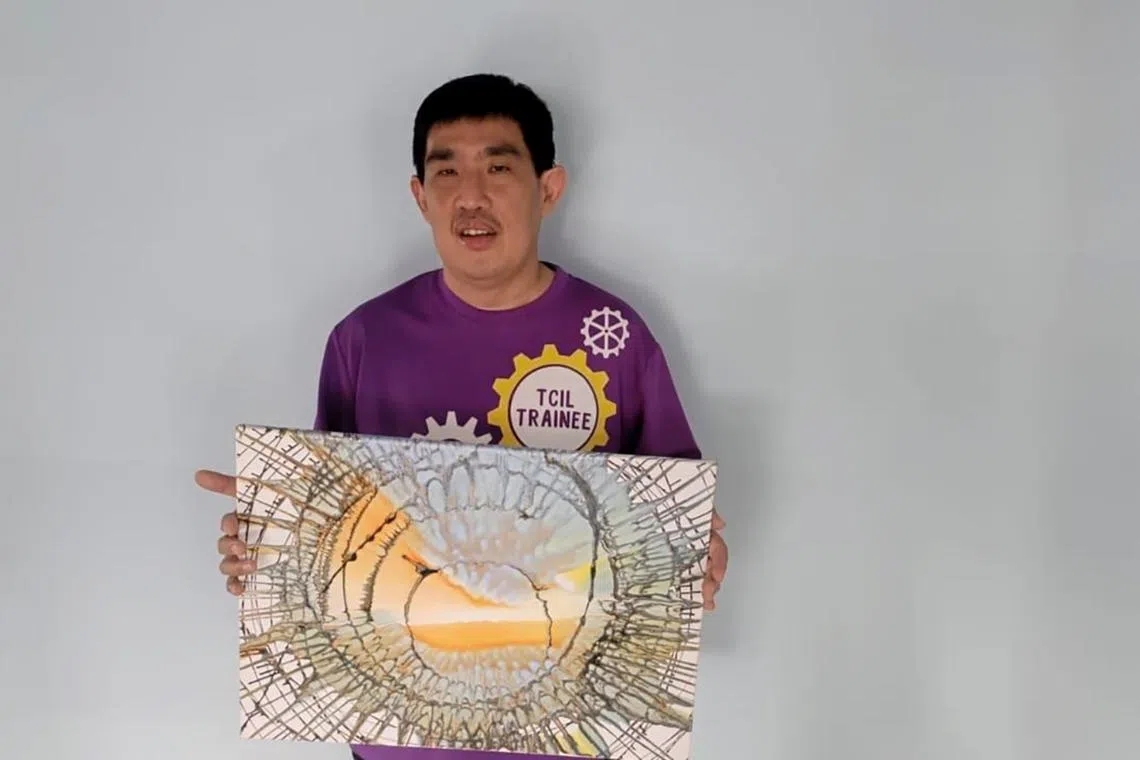 Mr Nigel Choo with an artwork he created at the Touch Centre for Independent Living.