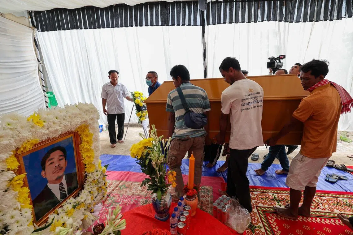 People carrying the coffin of a civilian killed along the Cambodia-Thailand border, amid accusations from both sides on Nov 12 of fresh clashes.