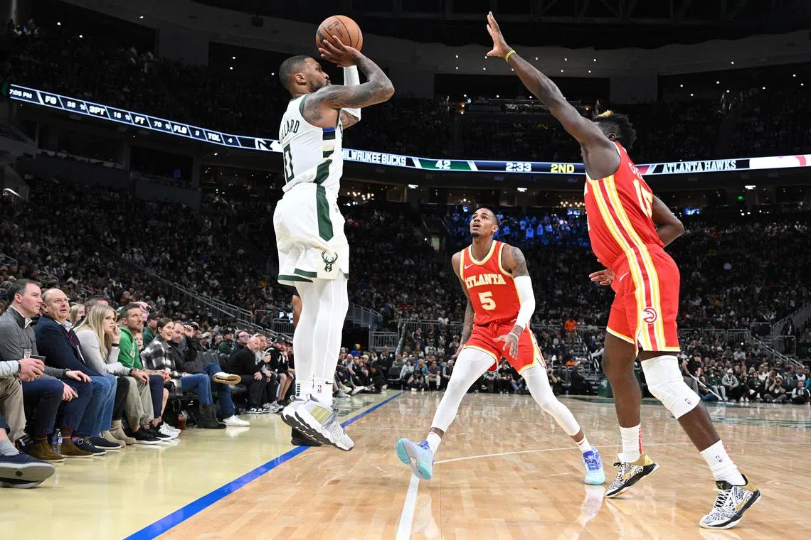 Milwaukee Bucks guard Damian Lillard missing a shot against the Atlanta Hawks in the second quarter at Fiserv Forum on Sunday. He was scoreless in the first half as the Bucks lost 127-110.
