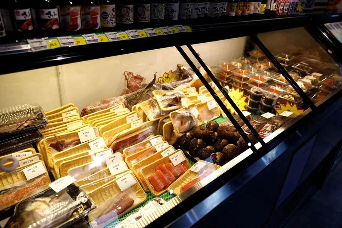 FILE PHOTO: Packs of raw fish are pictured at a Japanese food store, in Beijing, China July 25, 2023. REUTERS/Tingshu Wang