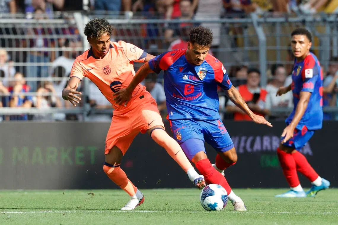 FC Barcelona’s Lamine Yamal (left) in action with Basel’s Coleen Louis in Basel, Switzerland, on Aug 16.