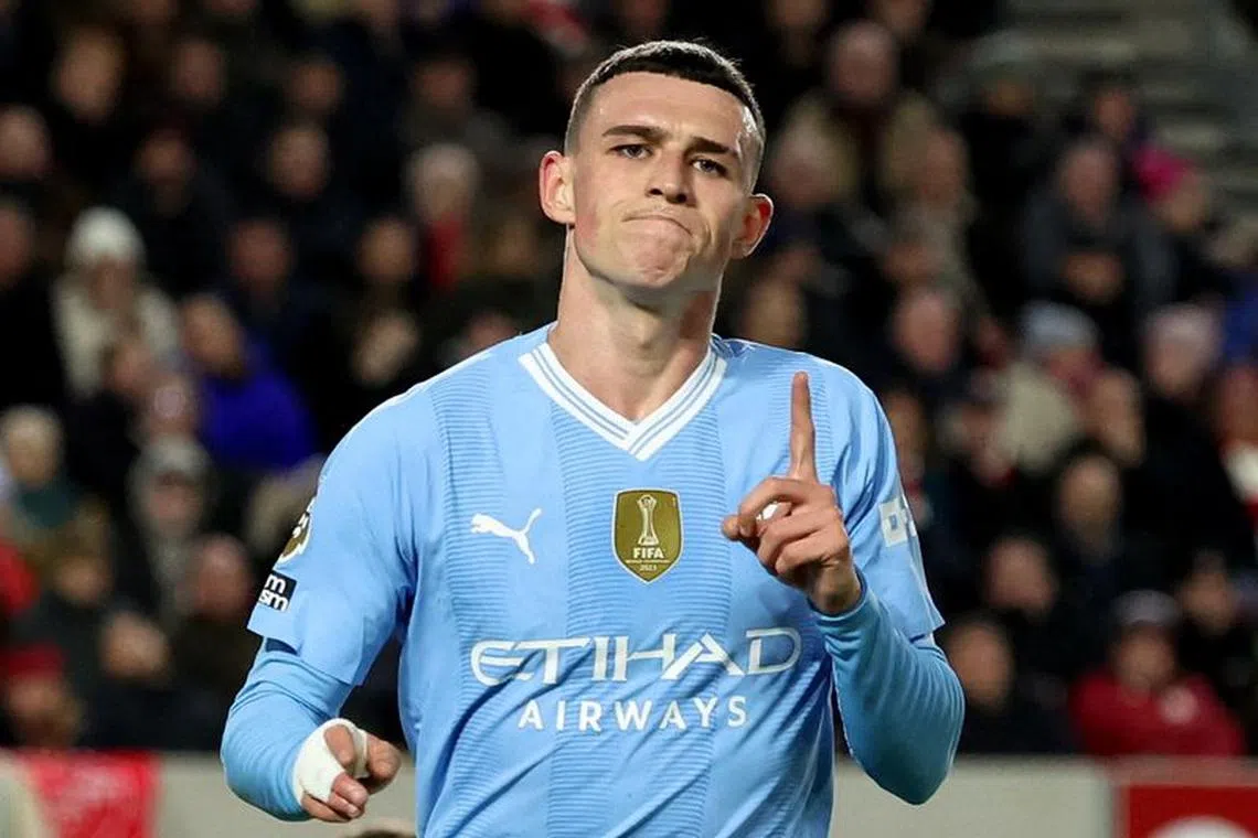 Soccer Football - Premier League - Brentford v Manchester City - Brentford Community Stadium, London, Britain - February 5, 2024 Manchester City's Phil Foden celebrates scoring their third goal and completing his hat-trick REUTERS/David Klein