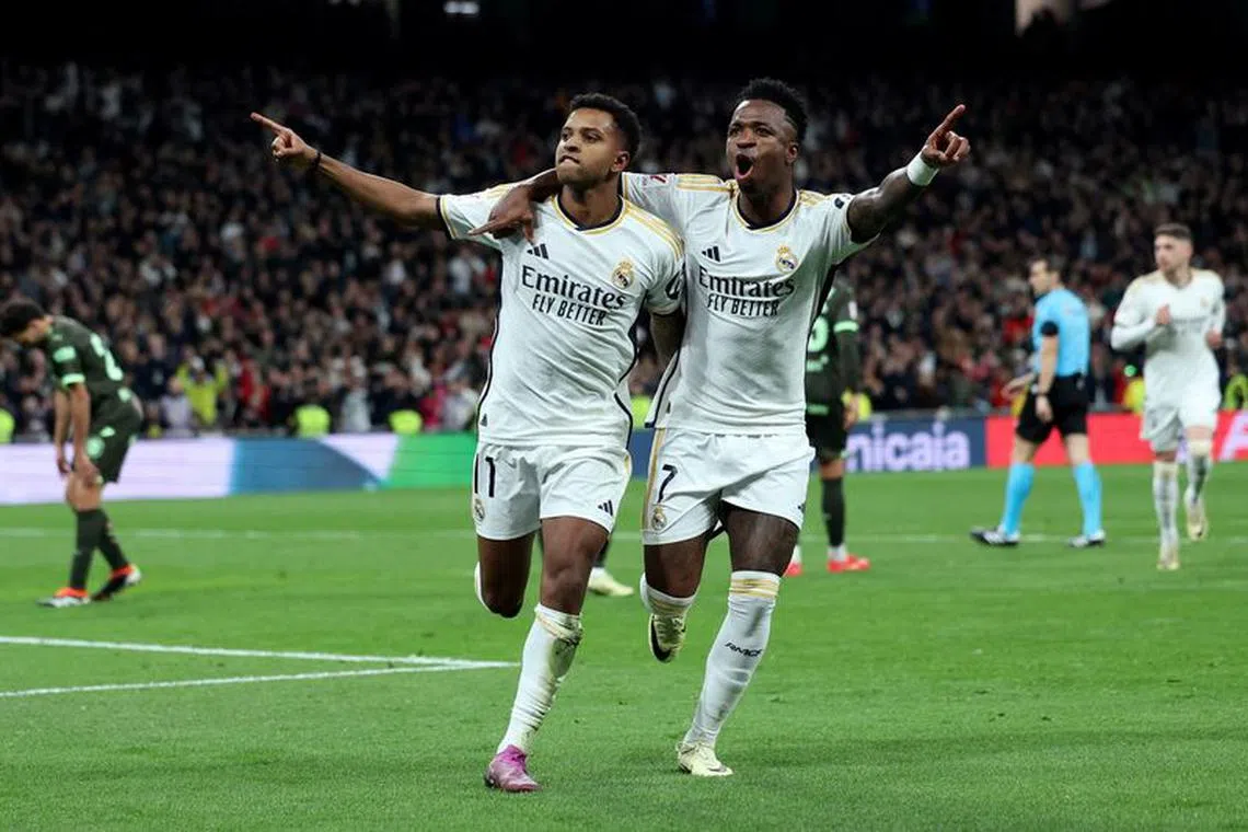 Soccer Football - LaLiga - Real Madrid v Girona - Santiago Bernabeu, Madrid, Spain - February 10, 2024 Real Madrid's Rodrygo celebrates scoring their fourth goal with Vinicius Junior REUTERS/Isabel Infantes     TPX IMAGES OF THE DAY