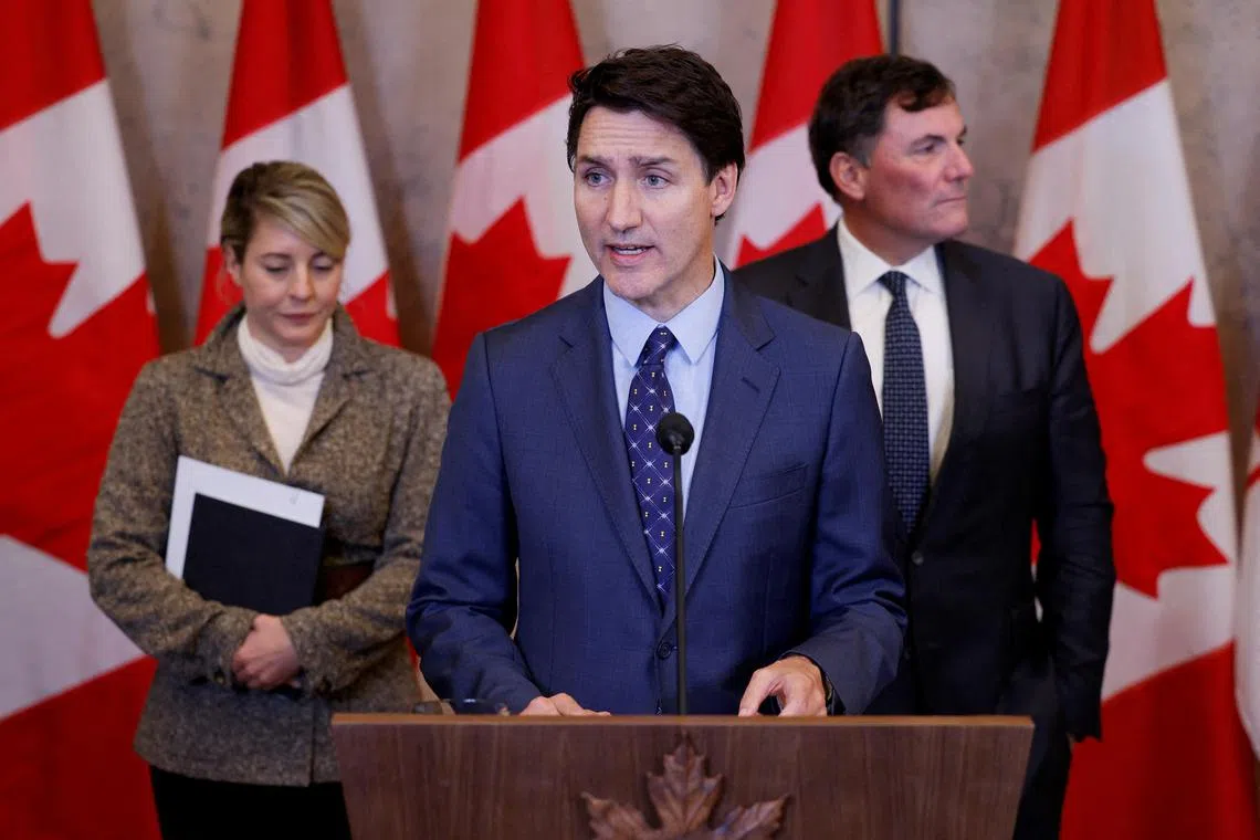 Canada's Prime Minister Justin Trudeau (centre), with Foreign Minister Melanie Joly (left), and Minister of Public Safety, Democratic Institutions and Inter-governmental Affairs Dominic LeBlanc, at a press conference to discuss the "violent criminal activity in Canada with connections to India" on Oct 14. 