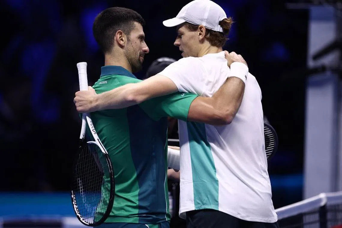 Tennis - ATP Finals - Pala Alpitour, Turin, Italy - November 15, 2023 Italy's Jannik Sinner speaks to Serbia's Novak Djokovic after winning their group stage match REUTERS/Guglielmo Mangiapane
