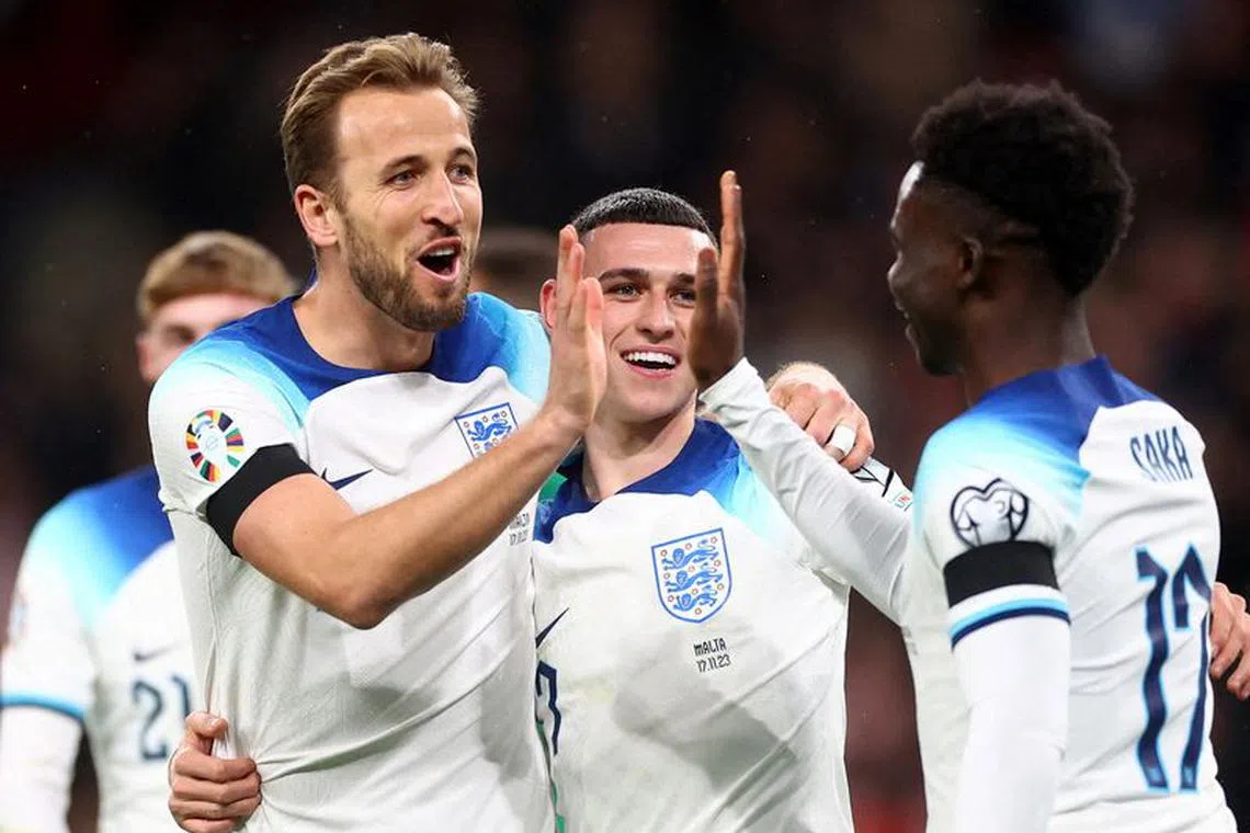 Soccer Football - UEFA Euro 2024 Qualifier - Group C - England v Malta - Wembley Stadium, London, Britain - November 17, 2023 England's Harry Kane celebrates scoring their second goal with Bukayo Saka and Phil Foden REUTERS/Carl Recine