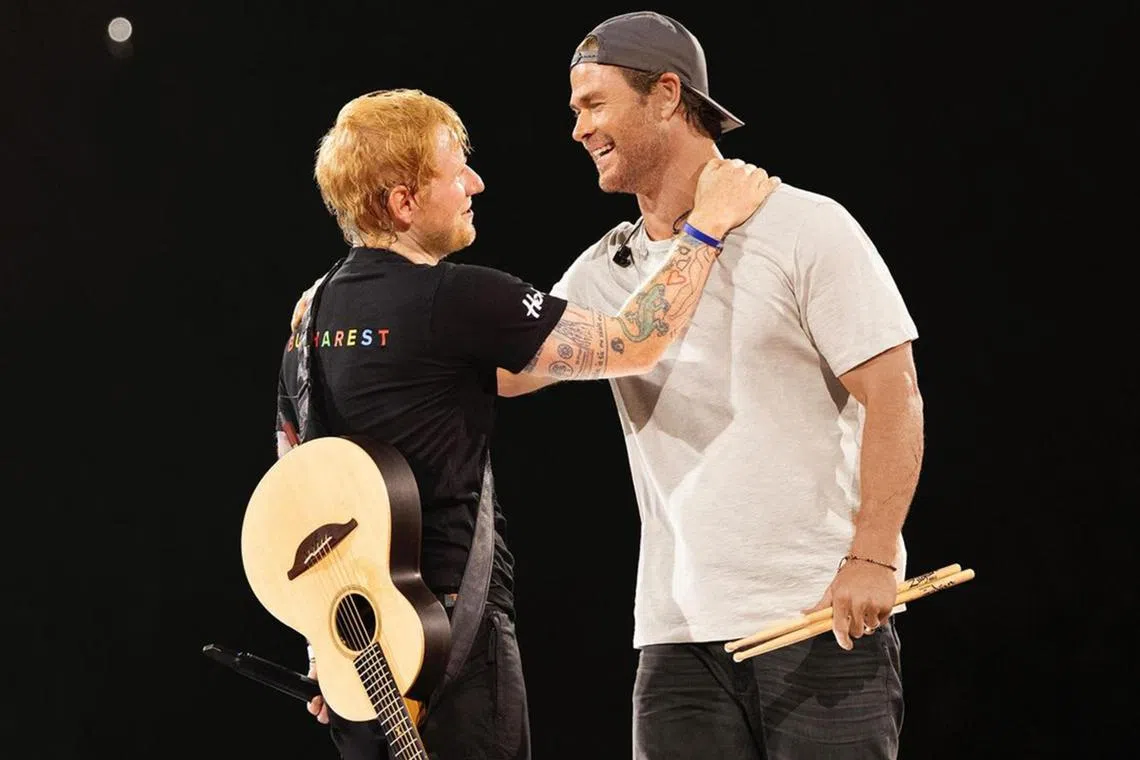 Chris Hemsworth (right) made a special appearance at English singer Ed Sheeran’s concert in Bucharest, Romania, as a drummer.