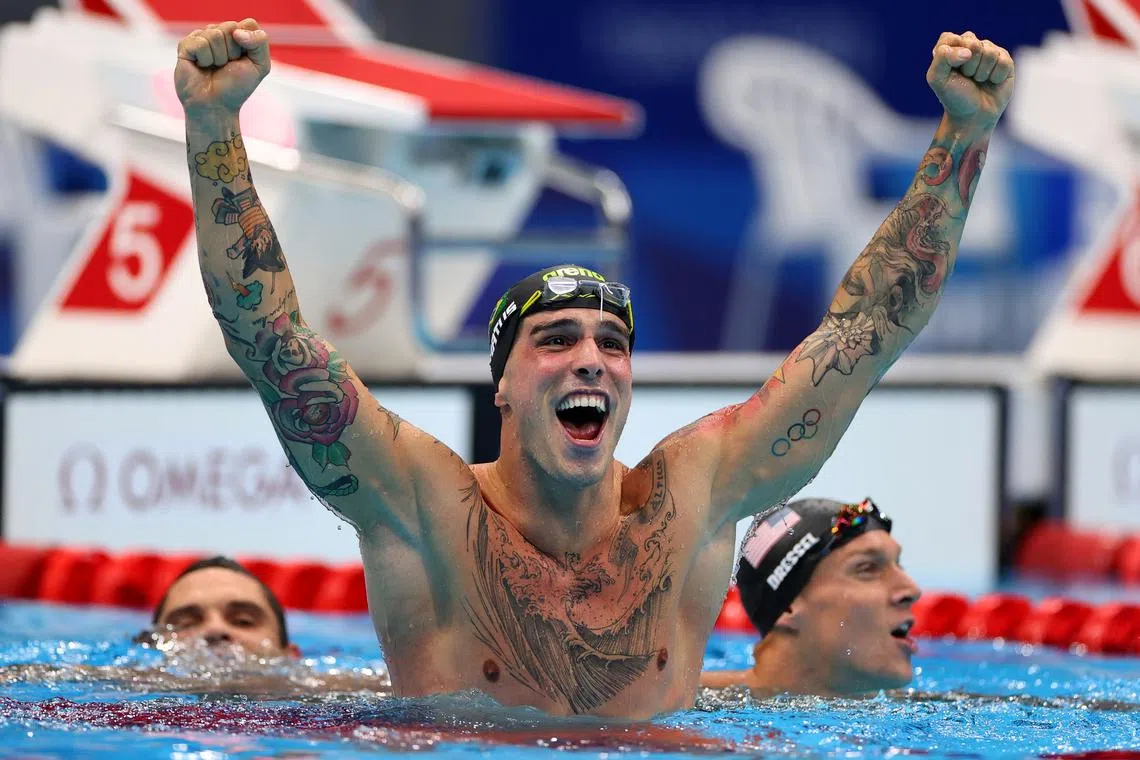 FILE PHOTO: Tokyo 2020 Olympics - Swimming - Men's 50m Freestyle - Final - Tokyo Aquatics Centre - Tokyo, Japan - August 1, 2021.  Bruno Fratus of Brazil reacts after winning the bronze medal next to Caeleb Dressel of the United States and Florent Manaudou of France REUTERS/Marko Djurica/File Photo