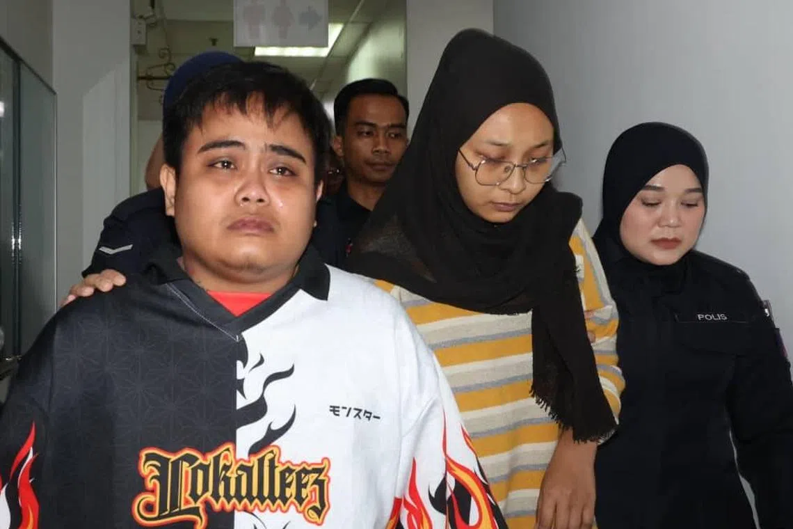 The boy's mother Nurul Asyiqin Mohamad Zahir (centre) and Awiin Chua were both charged with child abuse and neglect.