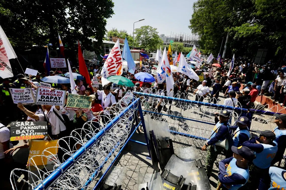 A protest rally in front of the Philippine Senate building in Pasay City, the Philippines, on July 6, on the opening day of Vice-President Sara Duterte’s impeachment trial.