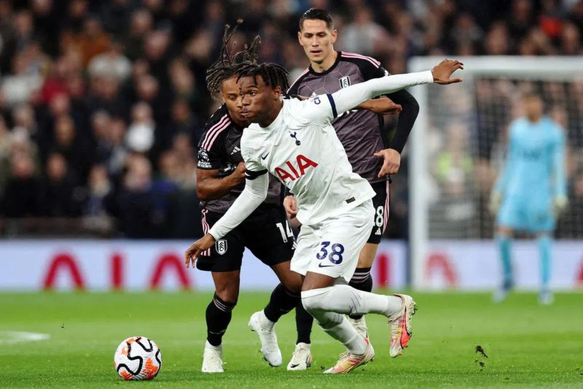 FILE PHOTO: Soccer Football - Premier League - Tottenham Hotspur v Fulham - Tottenham Hotspur Stadium, London, Britain - October 23, 2023 Tottenham Hotspur's Destiny Udogie in action with Fulham's Bobby Decordova-Reid REUTERS/David Klein