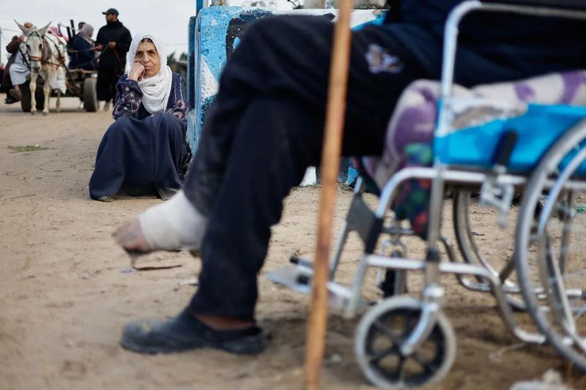 Palestinian patients rest as they arrive in Rafah after they were evacuated from Nasser hospital in Khan Younis due to the Israeli ground operation, amid the ongoing conflict between Israel and Hamas, in the southern Gaza Strip, February 15, 2024. REUTERS/Mohammed Salem/file photo