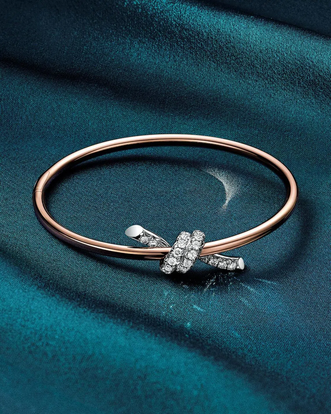 Tiffany Knot bangle in rose gold and platinum with diamonds.