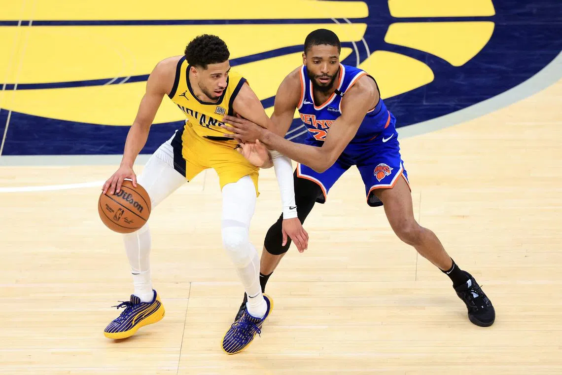 Tyrese Haliburton of the Indiana Pacers is defended by Mikal Bridges of the New York Knicks during the NBA Eastern Conference Finals.