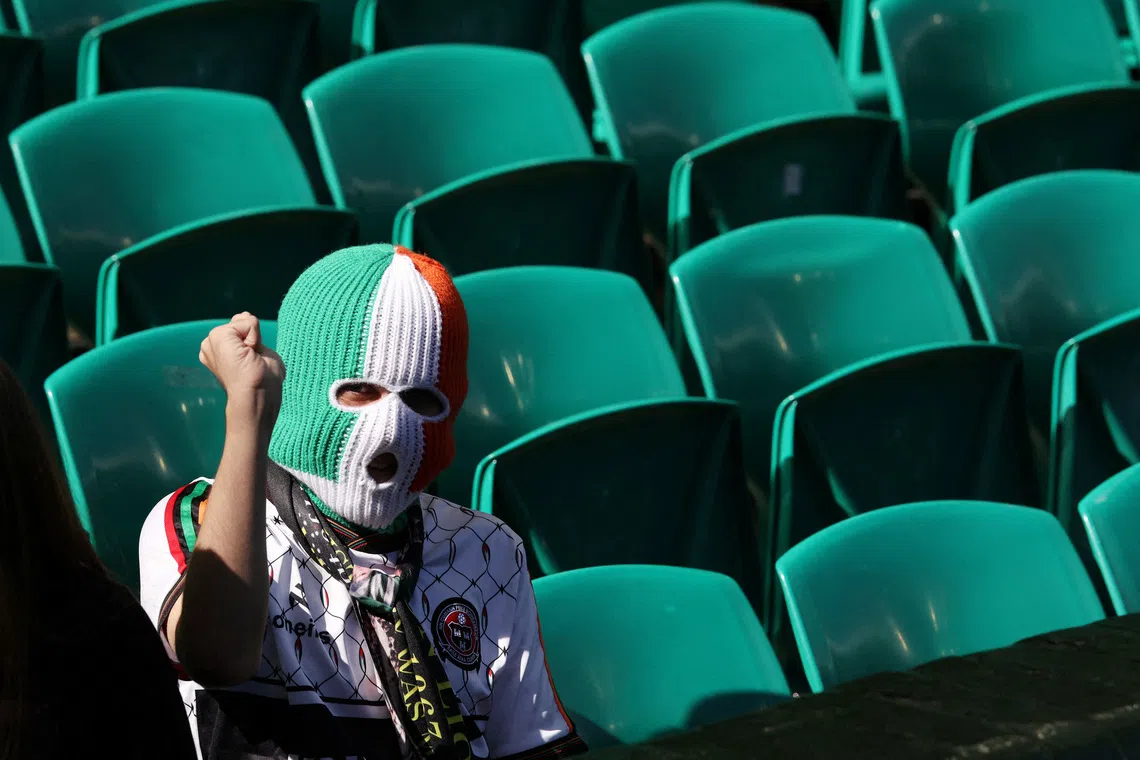 Soccer Football - Scottish Premiership - Celtic v Rangers - Celtic Park, Glasgow, Scotland, Britain - May 10, 2026 A fan wears a balaclava inside the stadium before the match REUTERS/Russell Cheyne