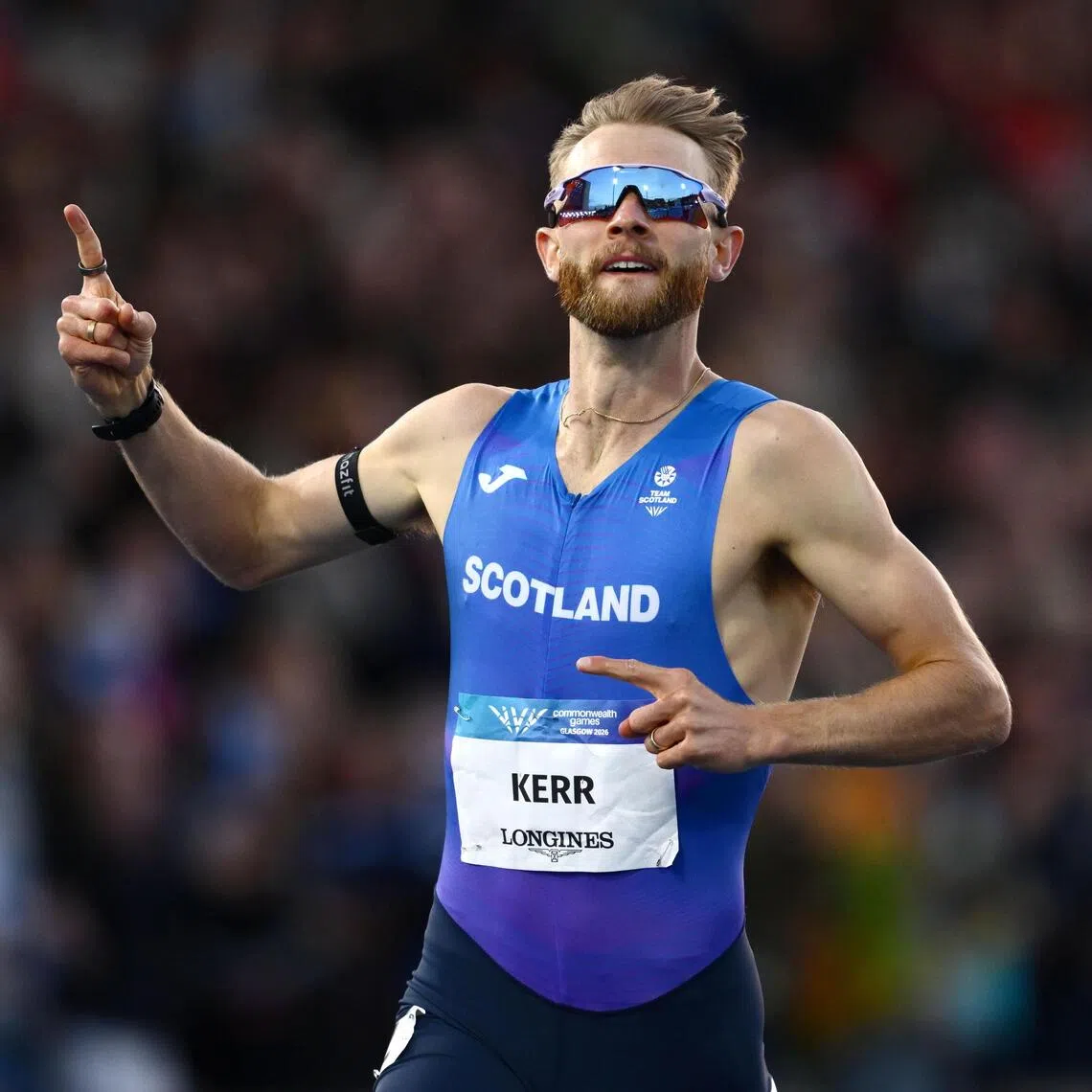Scotland’s Josh Kerr celebrates winning gold in the men’s one mile final on Aug 1.