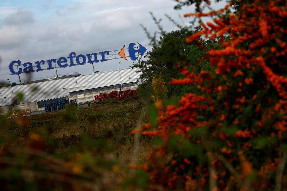 FILE PHOTO: A view shows the logo of French retailer Carrefour in front of a supermarket in Montesson near Paris, France, September 13, 2023. REUTERS/Sarah Meyssonnier/File Photo