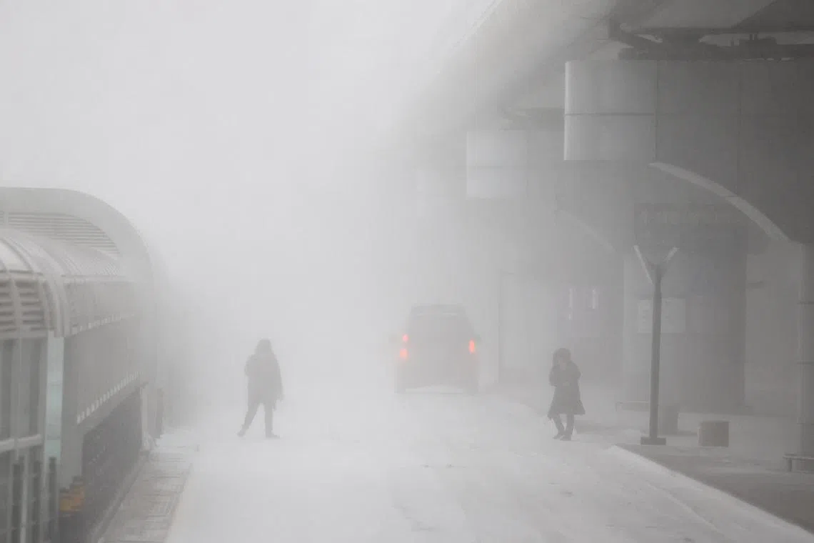 A blizzard in Jeju, South Korea, on Tuesday. Nearly 500 flights to and from Jeju International Airport were cancelled.