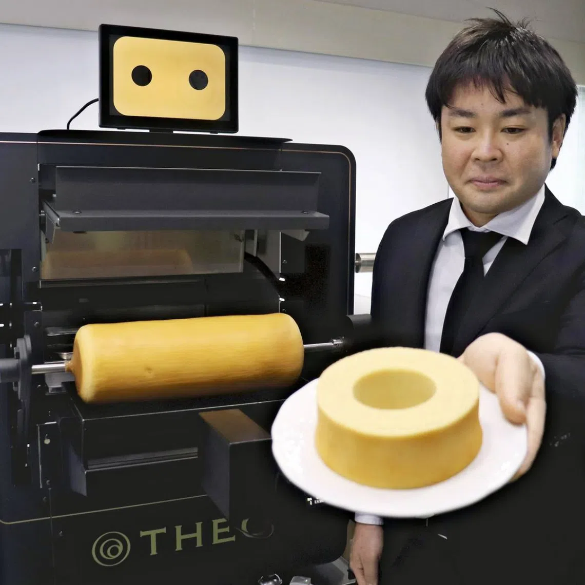 Juchheim’s AI-equipped cooking robot Theo, which was trained on and is able to recreate the baking technique of skilled workers, is seen in Chuo Ward, Kobe.
