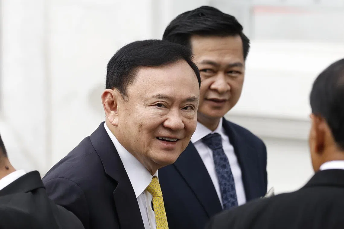 Former Thai PM Thaksin Shinawatra (L) at the Supreme Court in Bangkok, Thailand, on Sept 9.
