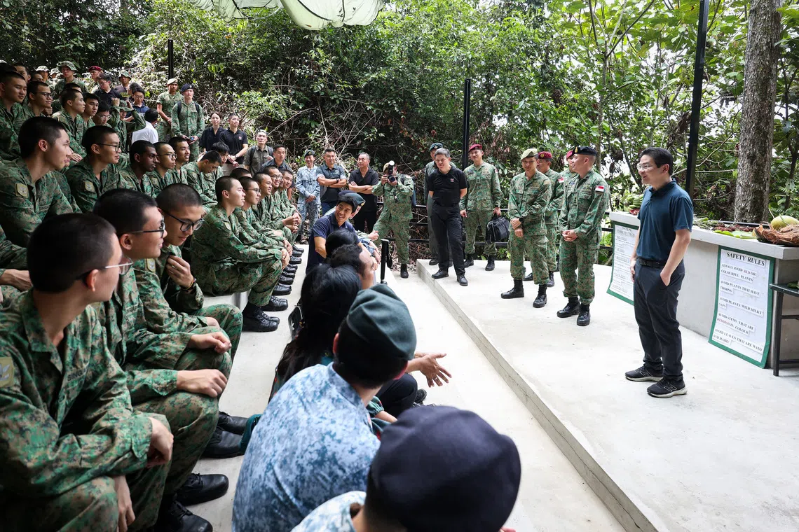 PM Lawrence Wong (right) and Defence Minister Chan Chun Sing meeting SAF personnel training in Temburong.