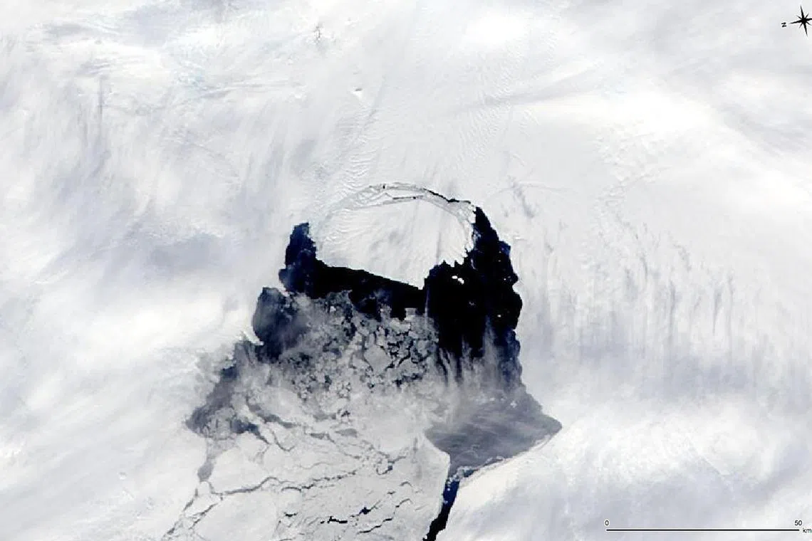 This image taken by NASA’s Aqua satellite shows an iceberg that was part of the Pine Island Glacier and is now separating from the Antarctica continent.