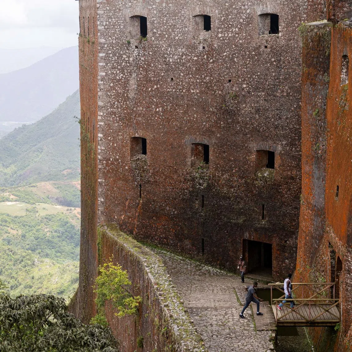 FILE PHOTO: People visit the Citadelle Laferriere, a fortress from the early 1800s commonly known as La Citadel in Milot, Haiti April 26, 2024. REUTERS/Ricardo Arduengo/File Photo