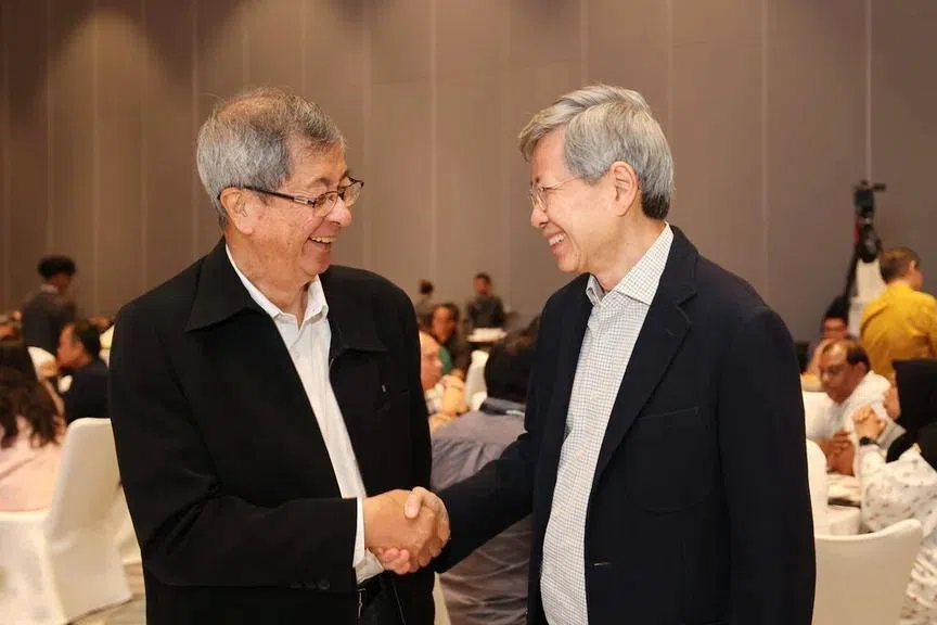 Mr Tan Hee Teck (right) will take over the reins from former Cabinet minister Lim Boon Heng (left). PHOTO: NTUC ENTERPRISE