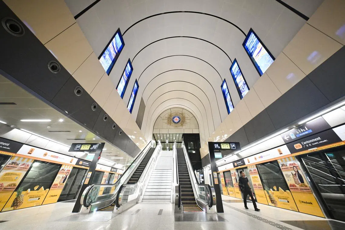 Cantonment station features a curved ceiling and 24 murals reminiscent of the railway station, along with a large analogue clock.